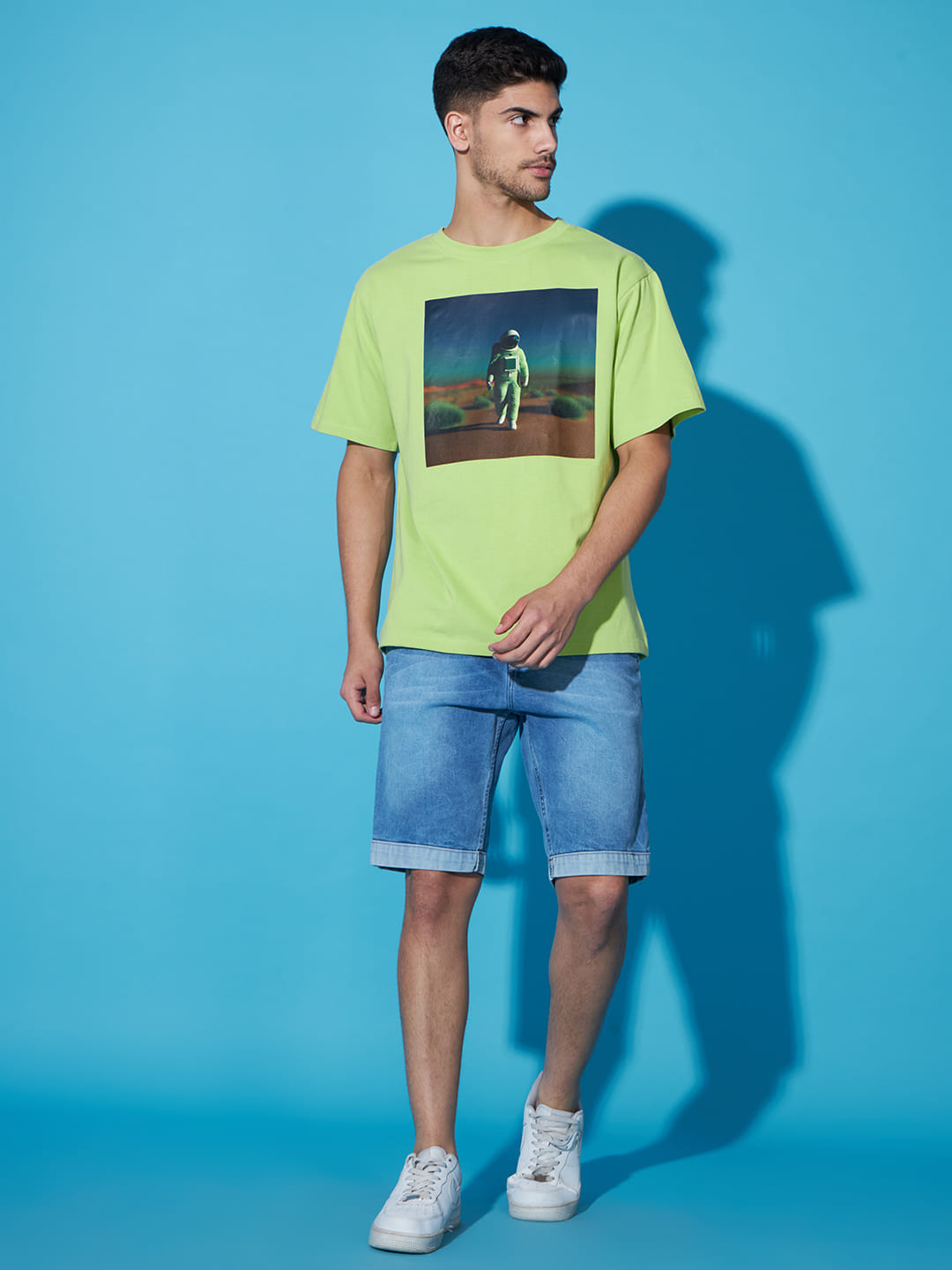 Majestic Echoes: A Men's Oversized Green Printed T-Shirt