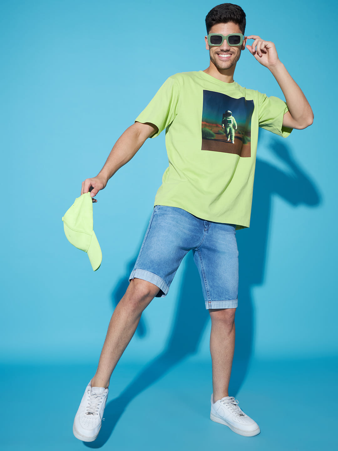 Majestic Echoes: A Men's Oversized Green Printed T-Shirt