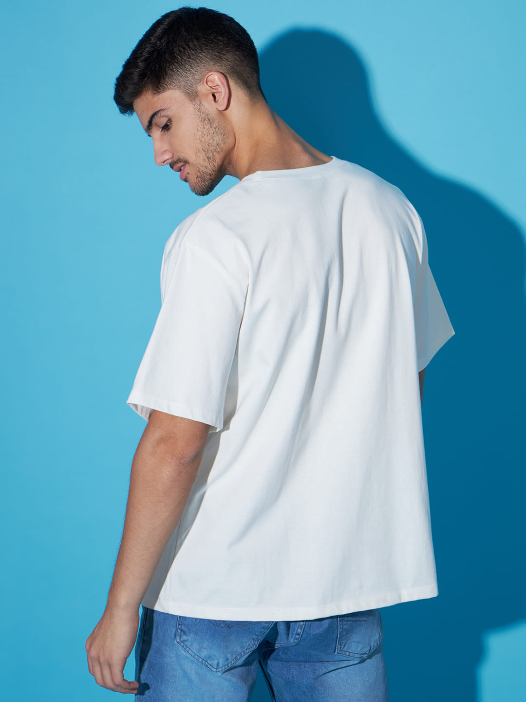 Digital Mirage: A Men's Oversized White T-Shirt with Front Print