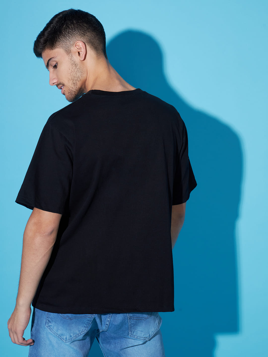 Shadows of Expression: A Black T-Shirt with Front Print