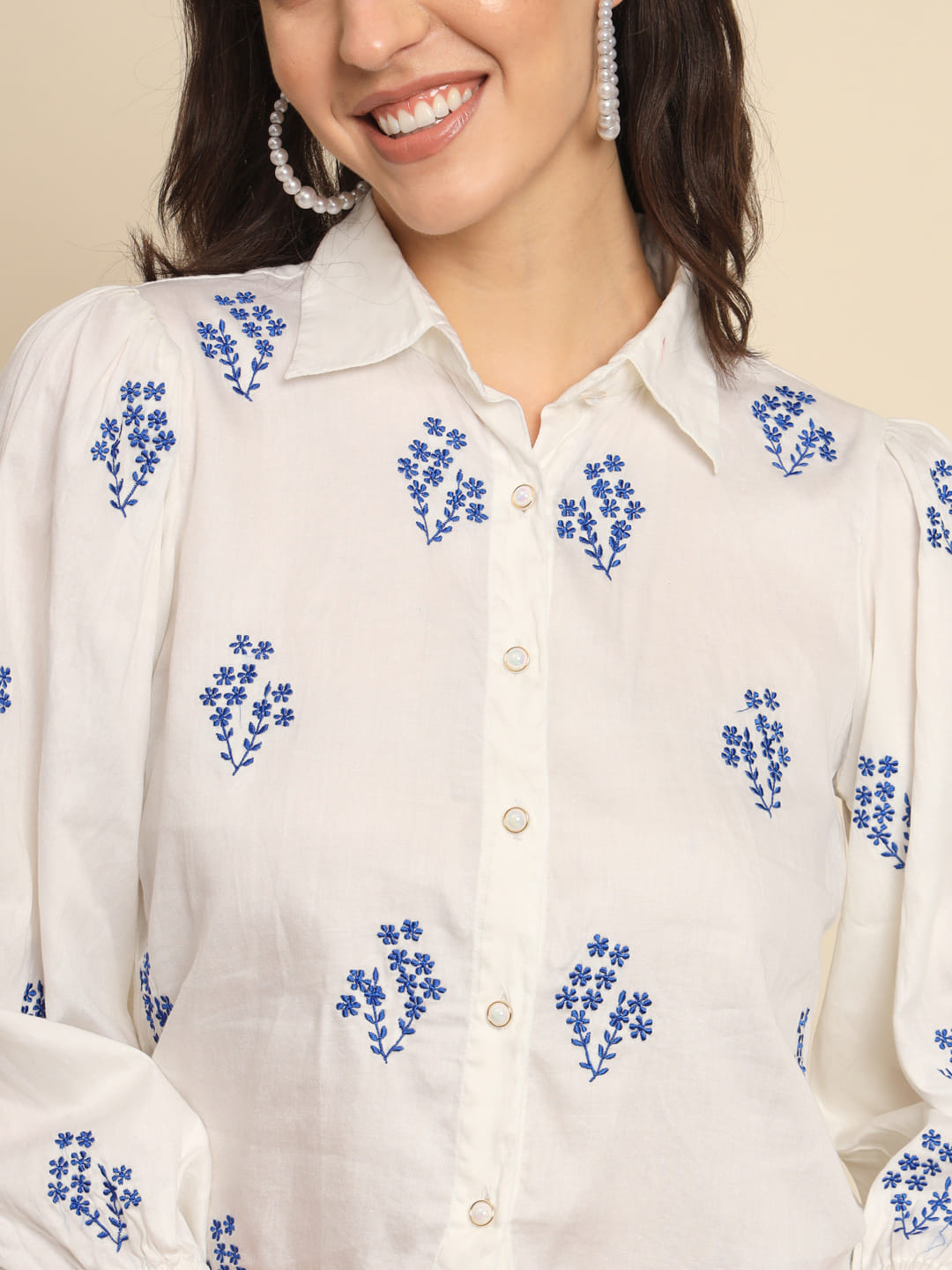 Whispers of Azure: A White Cotton Shirt with Blue Embroidery