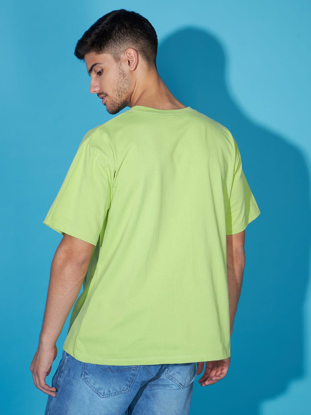 Majestic Echoes: A Men's Oversized Green Printed T-Shirt