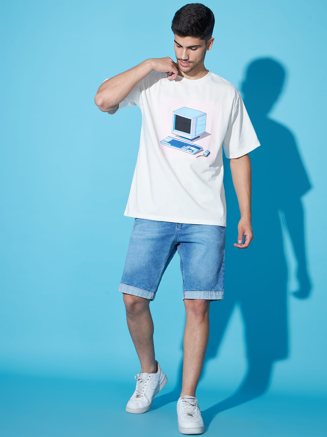 Digital Mirage: A Men's Oversized White T-Shirt with Front Print